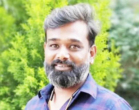 A two-wheeler hotelier was killed after being hit by a bus