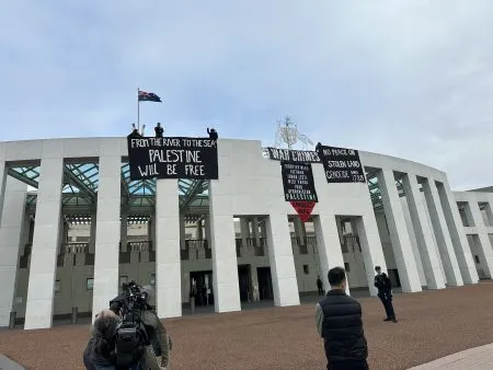 A 'Free Palestine' poster on the roof of the Australian Parliament
