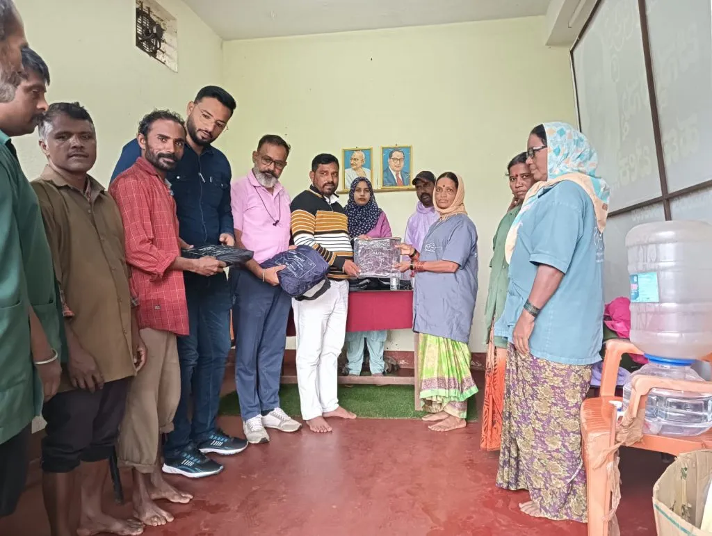 Distribution of raincoats to municipal sanitation workers