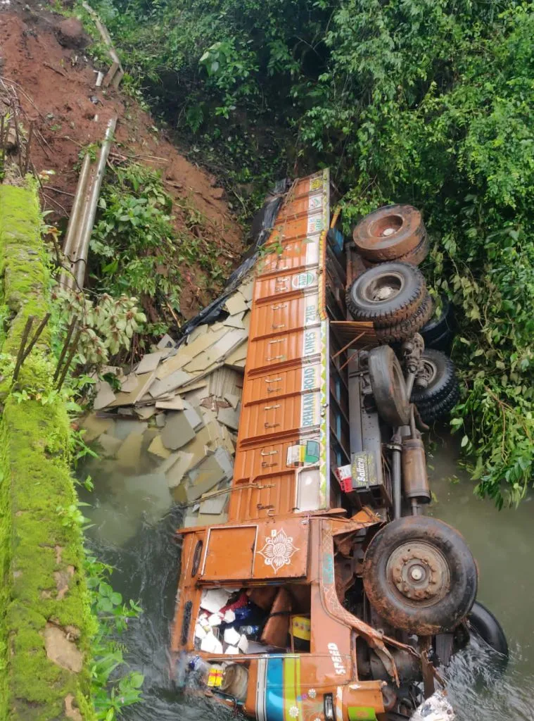 The heavy truck fell into the drain