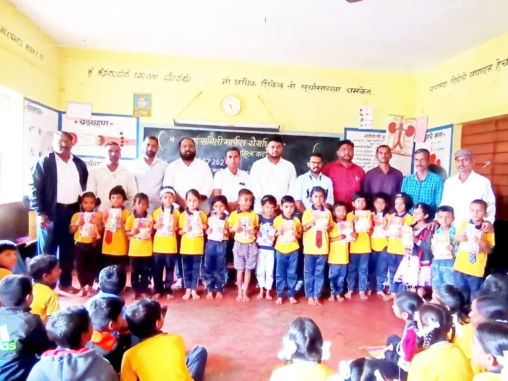 Distribution of educational materials by Yuva Samiti in Marathi schools in Taluka