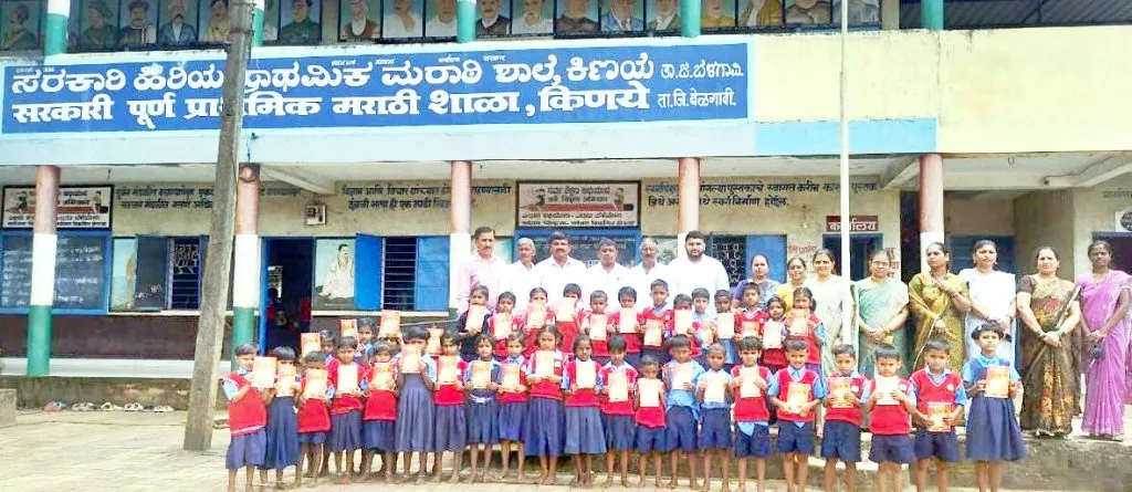 Distribution of educational materials to students of Kanye Marathi schools