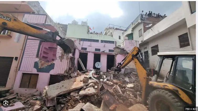 Bulldozer on accused student's house