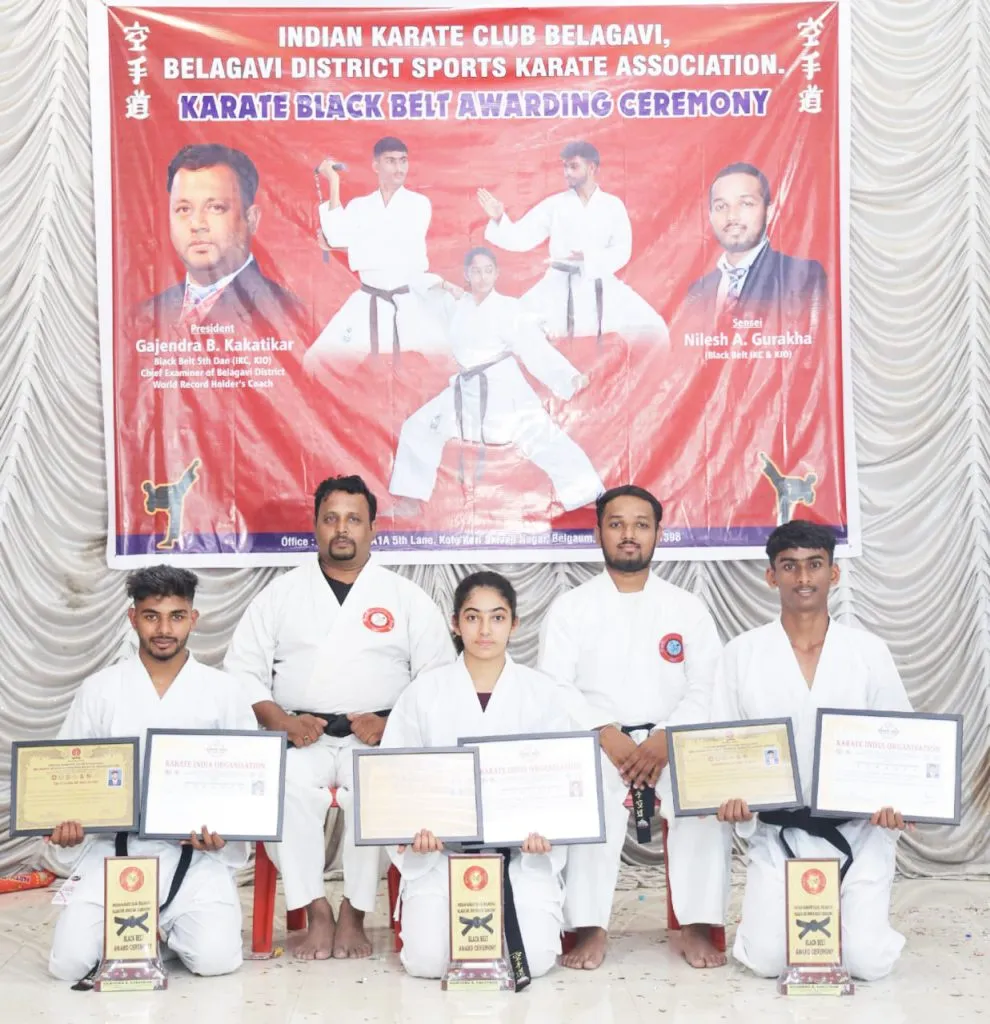 Black belts to three karatekas