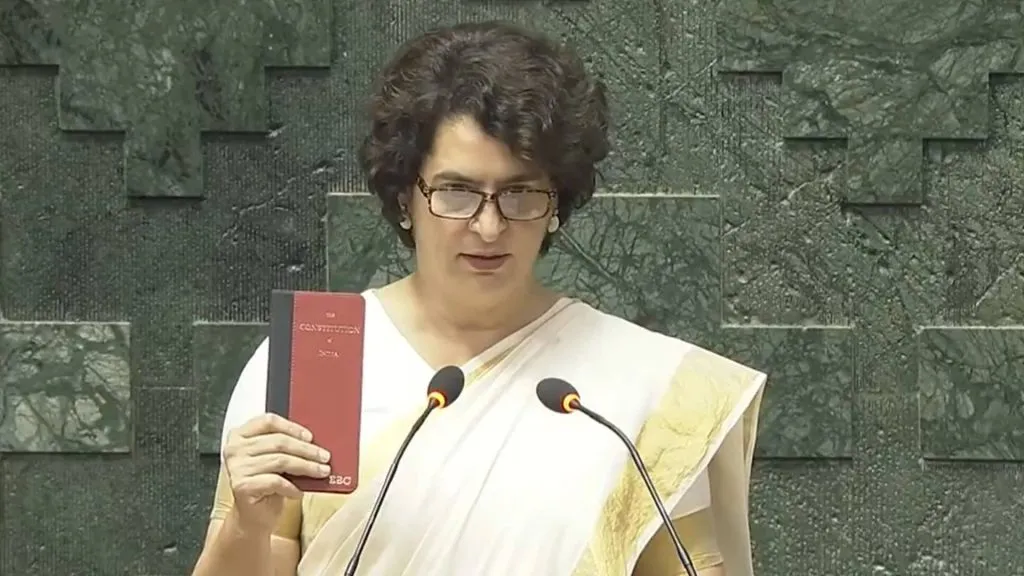 Priyanka Gandhi takes oath holding a copy of the Constitution