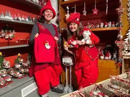 A woman works in Santa Claus's office.