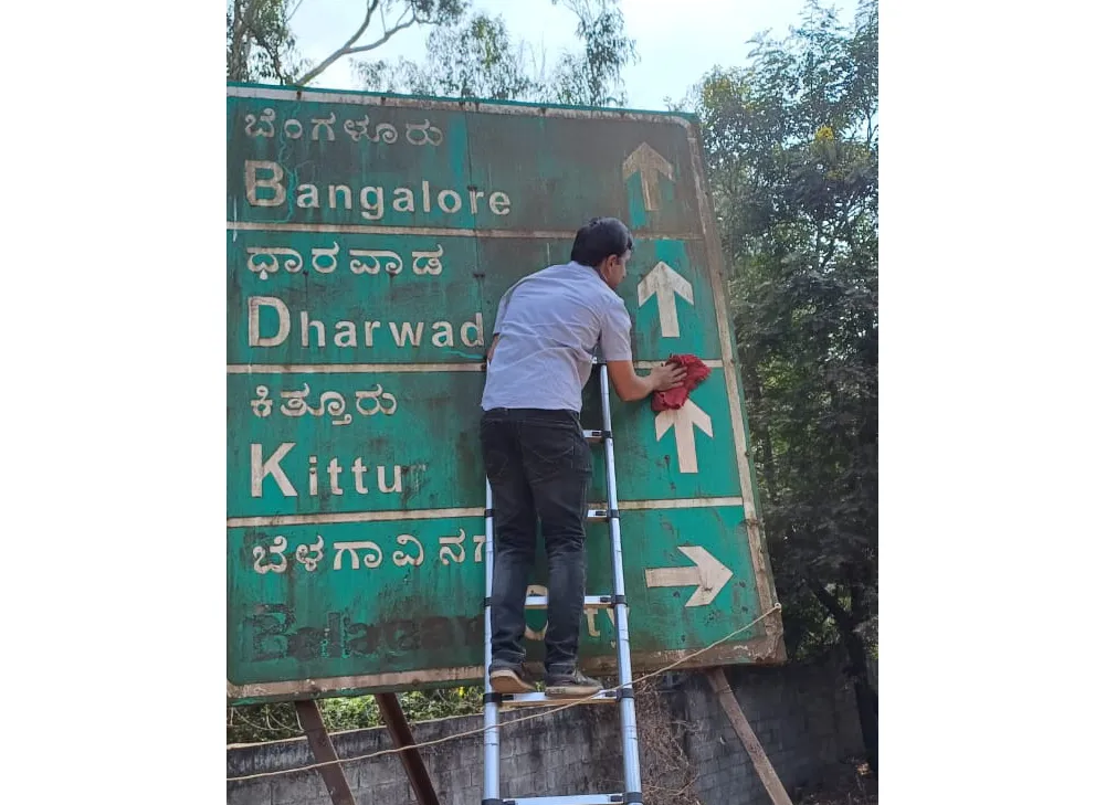 Cleaning of the signboard near Hindalco Bridge