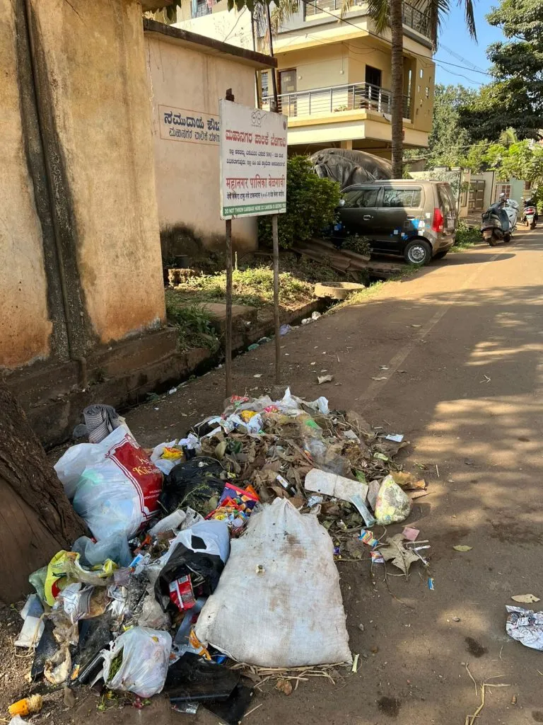 Garbage under notice boards in unmarked areas
