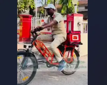 Postman will travel on an electric red bike