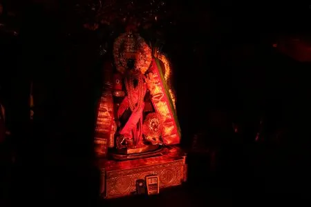 The sun's rays reach Ambabai's shoulders.