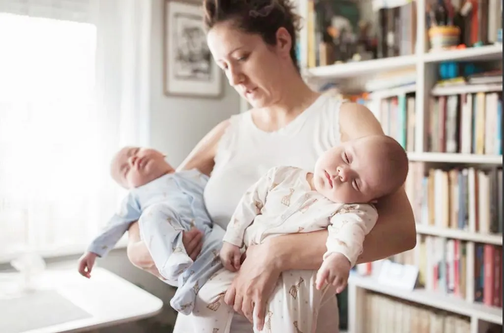 Woman carrying a fake baby