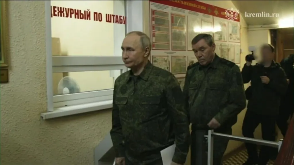 Putin visits Kursk in military uniform
