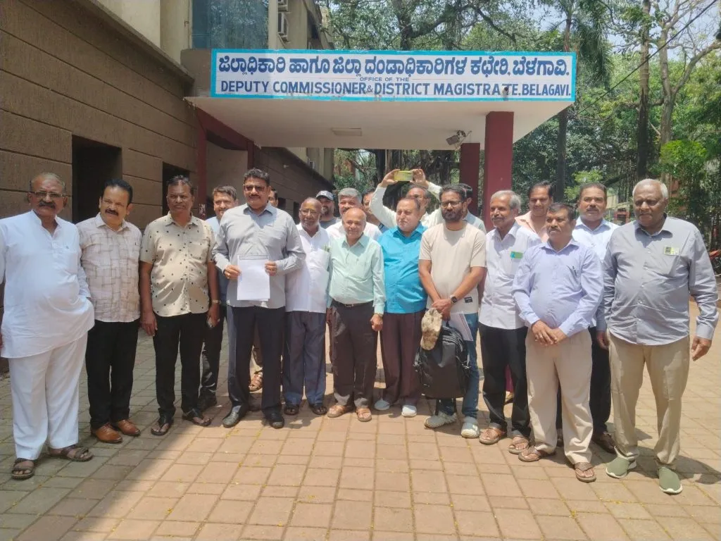 Liquor shopkeepers protest in front of the District Collector's Office