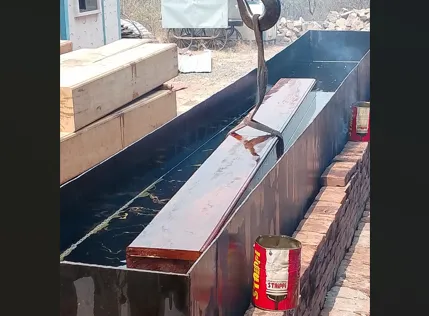 Linseed oil treatment on the wooden pillars of Garud Mandap in Ambabai Temple