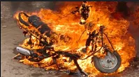 Unknown person set fire to a two-wheeler parked in the yard
