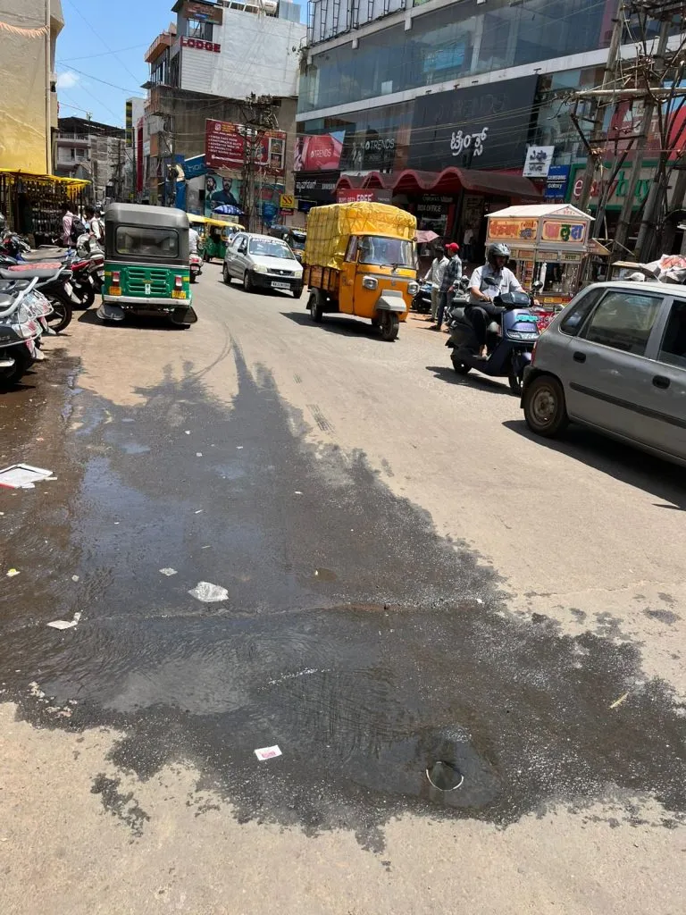 Water is wasted in the city in the middle of summer.