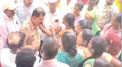 Police inspector confronted by women