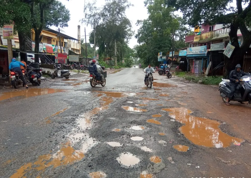 Potholes on the road near Rumewadi Cross