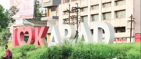 'I Love Karad' sign engulfed by parthenium weed