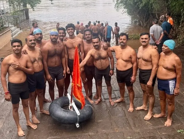 6 km Saffron Swimming Rally from Krishnamai Ghat to Haripur