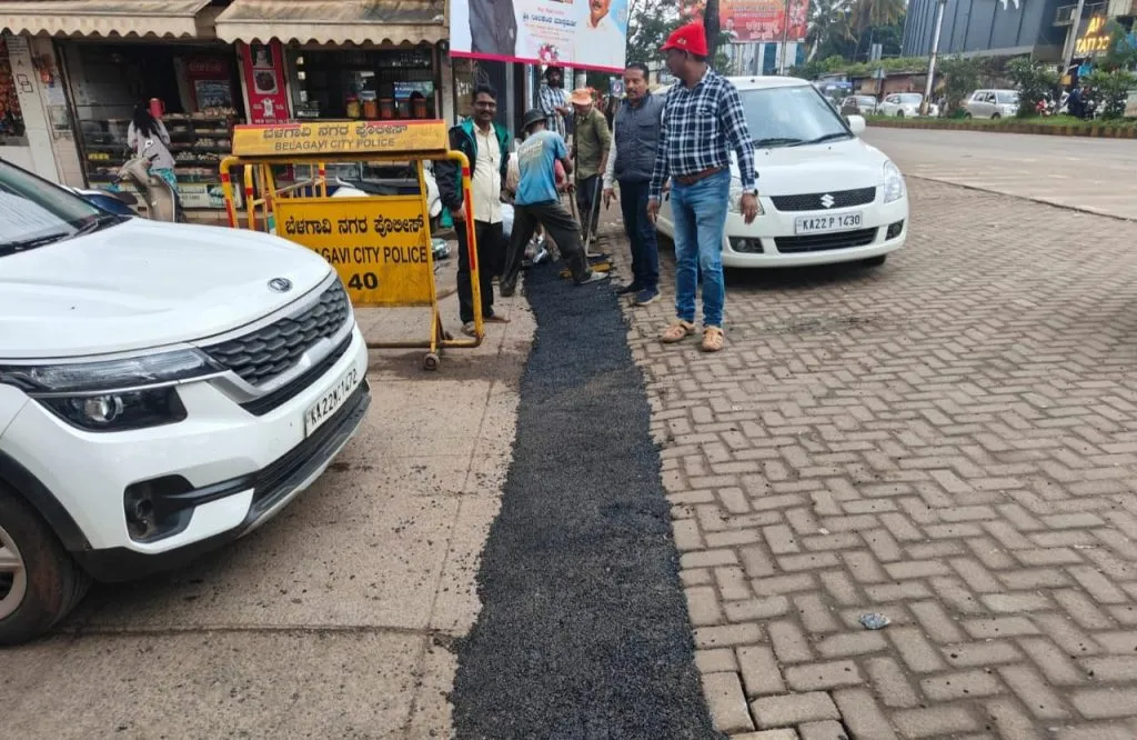 Cracks filled with cold asphalt at Deshmukh Road corner