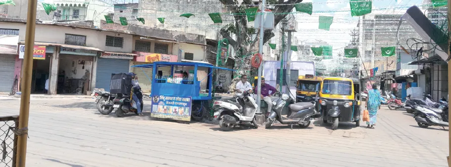 Badam Chowk bustling with two-wheelers and rickshaws