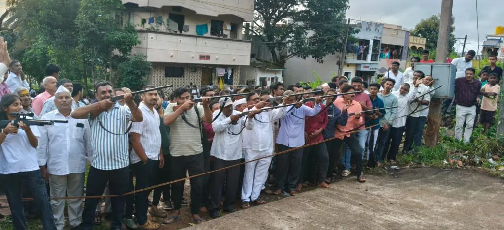 Coconut cracking event with gun in Kakati